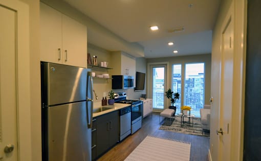 a kitchen and living room in a 555 waverly unit at Link Apartments® Canvas, Atlanta, 30312