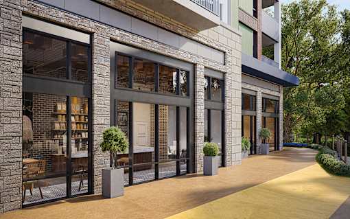 A modern building with a stone facade and large windows.