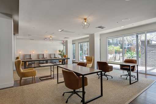 A conference room with a long table and chairs.