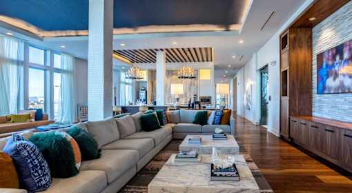 A modern living room with a grey sofa and a coffee table.
