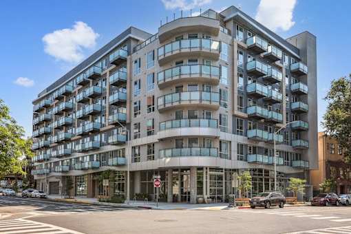 an apartment building on the corner of a city street at Link Apartments® Four 12, Oakland, CA