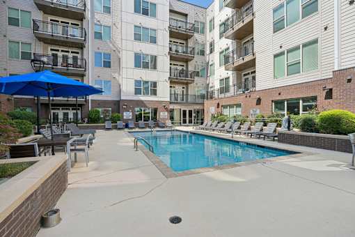 Courtyard swimming pool surrounded by apartment buildings at Link ® West End Apartments, South Carolina, 29601