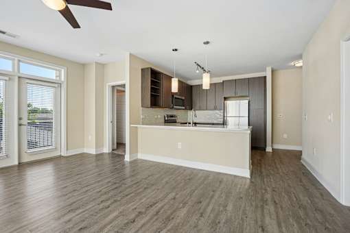 Spacious open floor plan with modern kitchen at Link ® West End Apartments, Greenville, SC