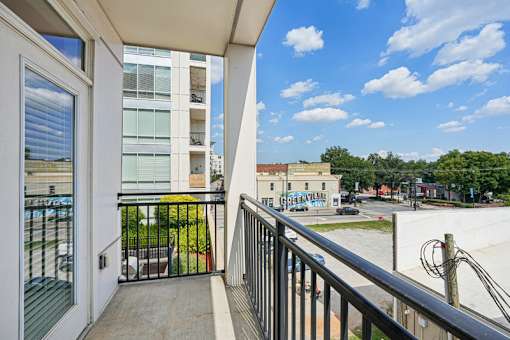 Private balcony overlooking street view at Link ® West End Apartments, Greenville, 29601