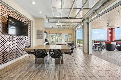 Rooftop lounge with outdoor terrace and dining at Link ® West End Apartments, Greenville, South Carolina