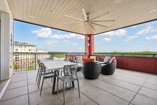 Rooftop terrace with dining table and lounge seating at Link ® West End Apartments, South Carolina