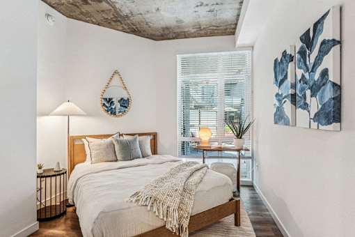 a bedroom with a bed and a window at Link Apartments® Four 12, California, 94607
