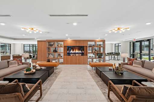 Spacious resident lounge with fireplace and seating at Link ® Lake Park Apartments, Smyrna