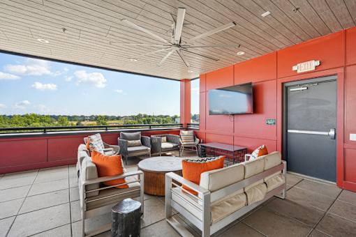 Rooftop terrace with seating and skyline views at Link ® West End Apartments, South Carolina, 29601