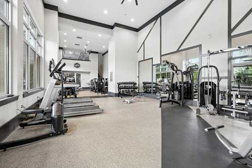 Fitness center with strength training equipment at Link ® West End Apartments, Greenville, SC