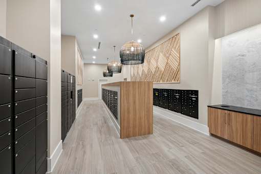 Mail room with package lockers and pendant lighting at Link ® Lake Park Apartments, Smyrna, GA 30080