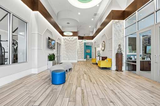 Elegant lobby entrance with high ceilings and wood accents at Link ® West End Apartments, South Carolina