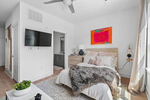 Bedroom with ensuite bathroom and ceiling fan at Link ® Lake Park Apartments, Georgia, 30080