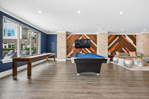 Game room with pool table and shuffleboard at Link ® West End Apartments, Greenville, 29601