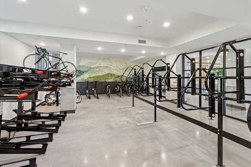 A bike shop with a row of bikes on the wall at Link Apartments® CYKEL Apartments, Charlotte