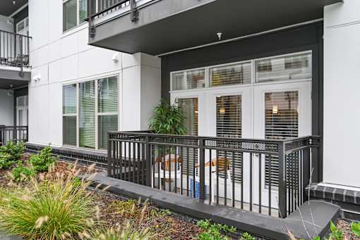 the front of a building with windows and a balcony at Link Apartments® Mint Street, Charlotte, North Carolina