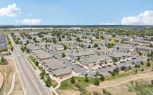 A large suburban housing development with a road running through it.