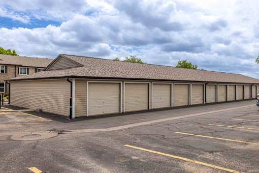 A long row of garage doors are closed.