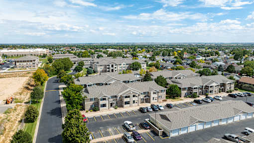 A parking lot is in front of a building.