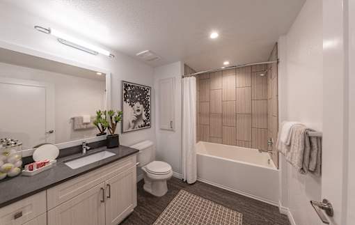 spacious bathroom with white countertops