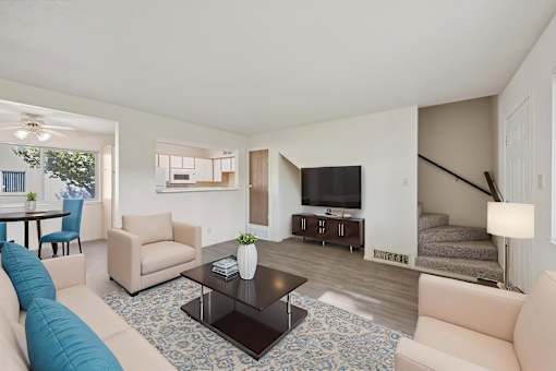 A living room with a blue couch and a television.