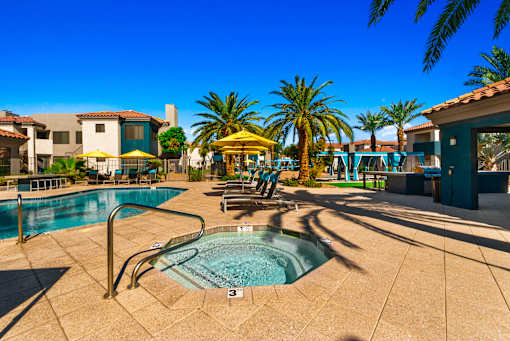 Pool side at Sonoran Apartment Homesbuildings in the background