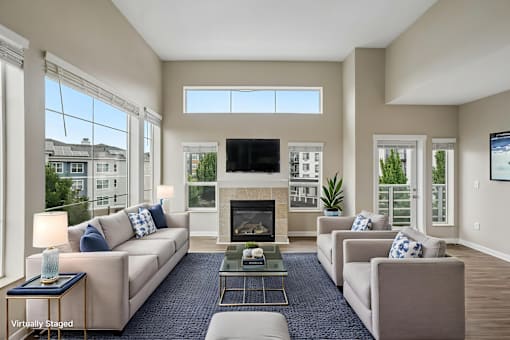 A living room with a fireplace and a television.