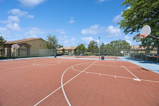 A basketball court with a net and hoop.