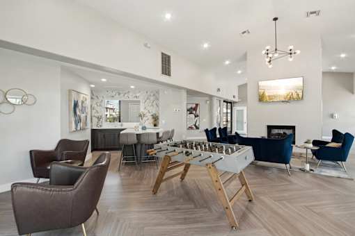 A modern living room with a fireplace and a dining table.