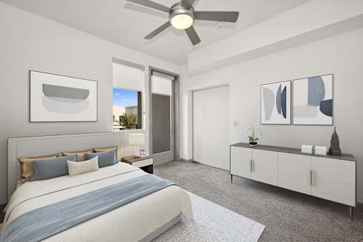 a bedroom with a large bed and a ceiling fan