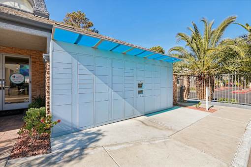 A blue and white garage door is closed.