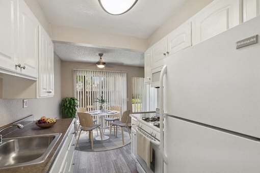 kitchen with dining room table and patio
