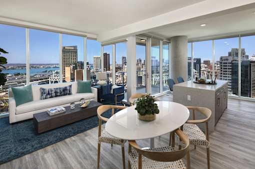 A modern living room with a view of the city skyline.