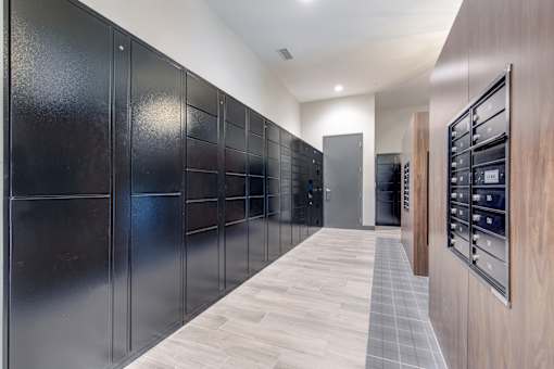 a long hallway with a long row of refrigerators in a large room with wood