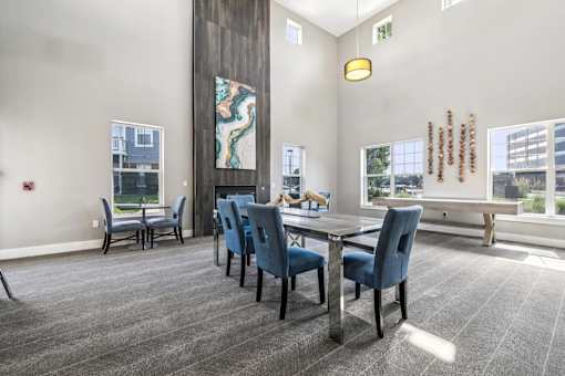 A conference room with a long table and chairs.