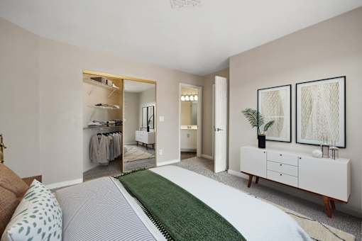 a bedroom with a bed and a dresser and a closet