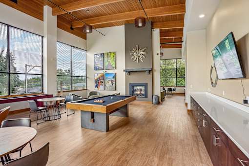 A billiard table is in the middle of this room.