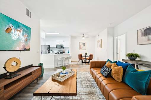 Living room with brown leather couch and coffee table