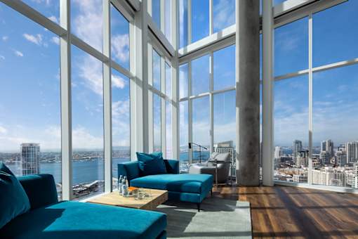 A living room with a view of the cityscape.