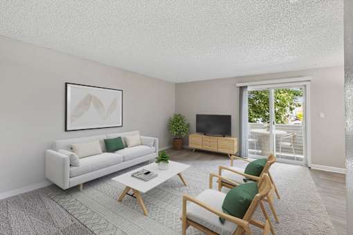 the living room of an apartment with a white couch and chairs