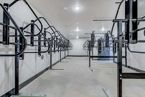 a row of exercise machines in a room