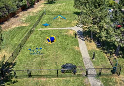 an aerial view of a park with playground equipment