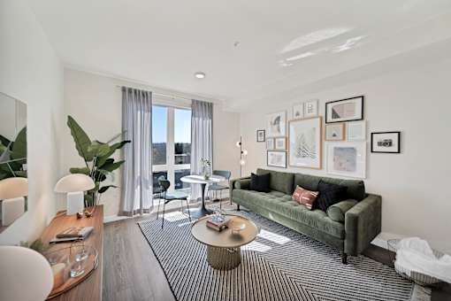 a living room with a green couch and a coffee table