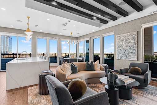 A modern living room with a large window overlooking a cityscape.