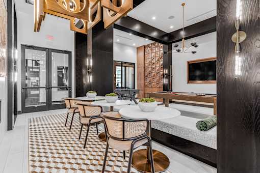 A modern dining room with a checkered floor and a wooden table.