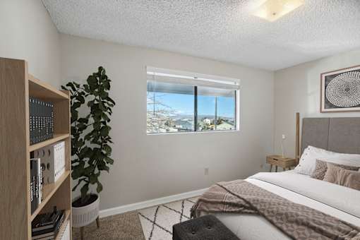 a bedroom with a bed and a window
