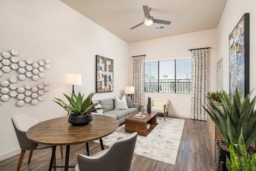 a living room with a round table and a couch
