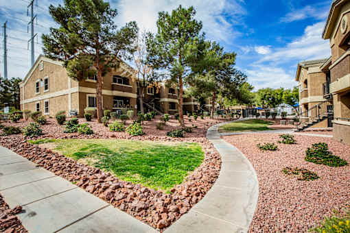 A residential area with houses and a curved pathway.