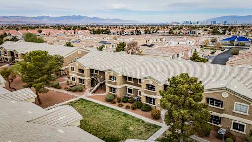 A bird's eye view of a residential area with houses and trees.