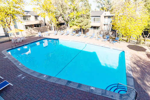 a swimming pool with chairs
